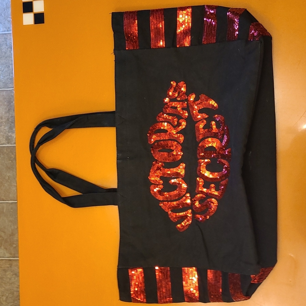 VICTORIA'S SECRET black canvas bag with red sequined logo